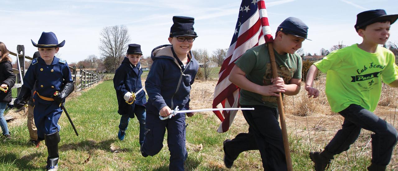 Photograph of children dressed up as Union soldiers reenacting the Civil War